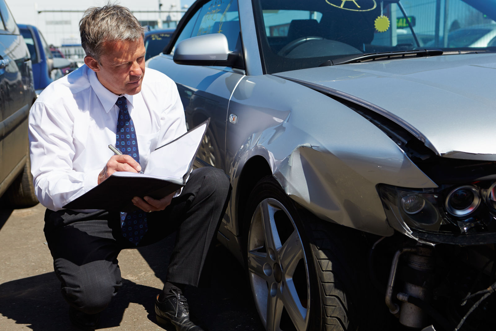 What do car insurance adjusters do?
